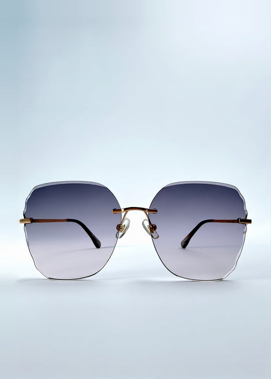 Front view of Lucera sunglasses in Misty Rosé, featuring rimless gold-tone frame and misty rose gradient lenses, showing the full front silhouette. 
