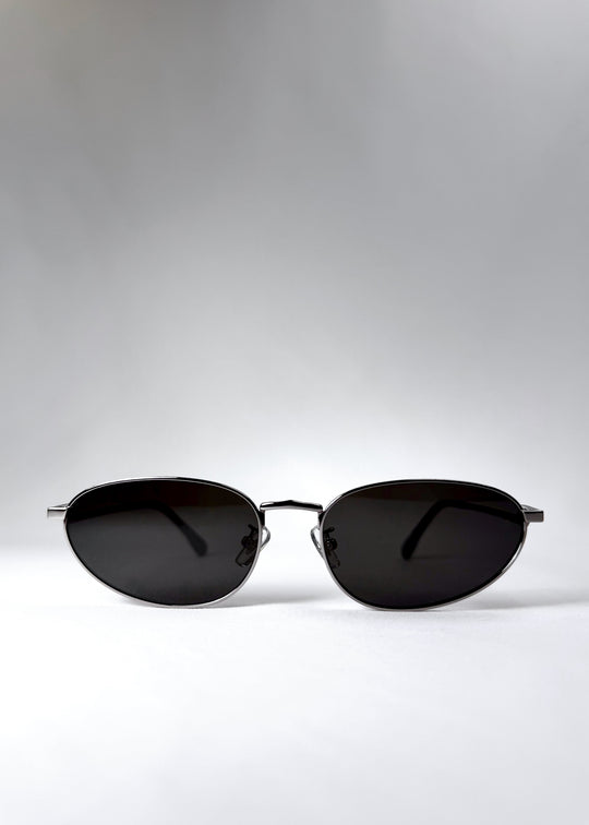 Front view of Lunaris - Moonlit Silver sunglasses, showcasing its shiny silver aviator frame and neutral grey lenses. 