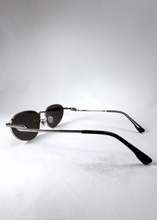 Side view of Lunaris - Moonlit Silver sunglasses, showing sleek temples and subtle curve of the frame arms. 