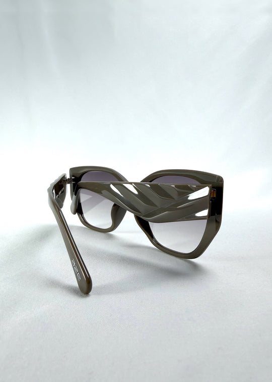 Back-angle view of Marlowe sunglasses in Graphite Haze, featuring grey-brown acetate frame and smoky lenses, showing the back structure and temple alignment.