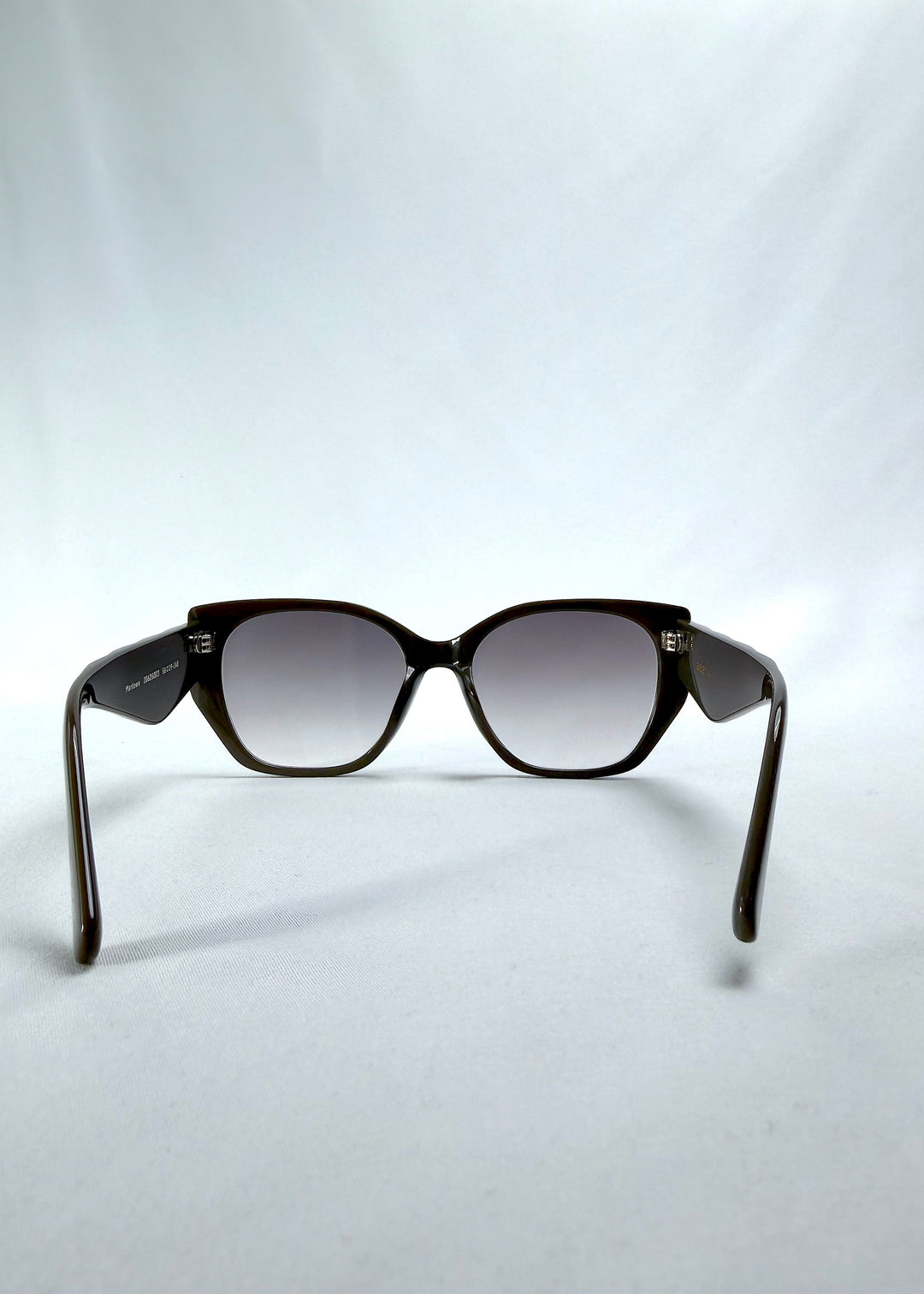 Back view of Marlowe sunglasses in Graphite Haze, featuring grey-brown acetate frame and smoky lenses, showing the inside frame and open temples.