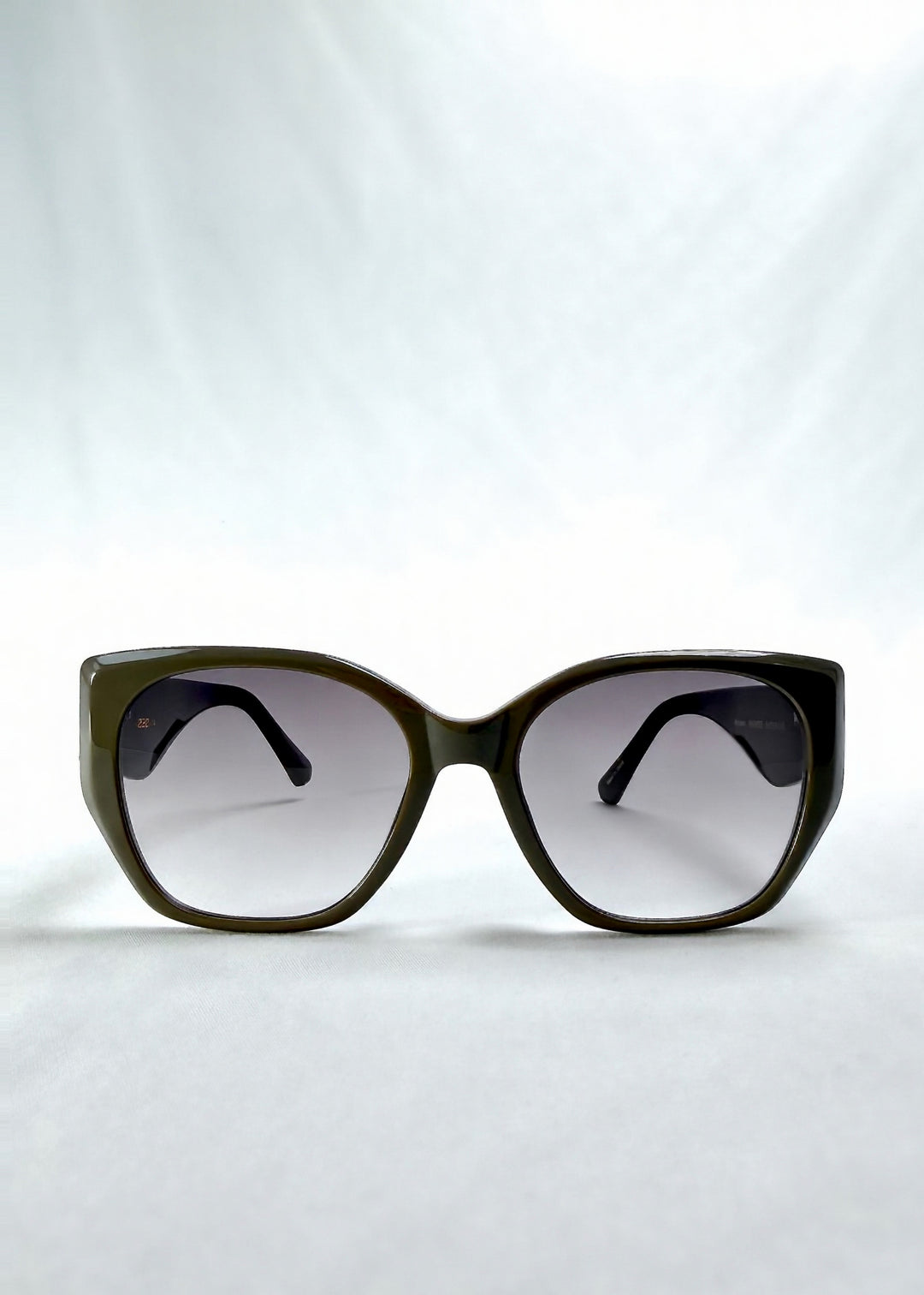 Front view of Marlowe sunglasses in Graphite Haze, featuring grey-brown acetate frame and smoky lenses, showing the full front silhouette.