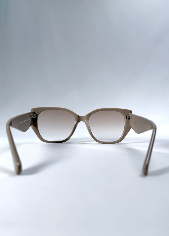 Back view of Marlowe sunglasses in Mauve Mist, featuring a sculpted translucent mauve acetate frame and soft gradient lenses, showing the inside frame and open temples.