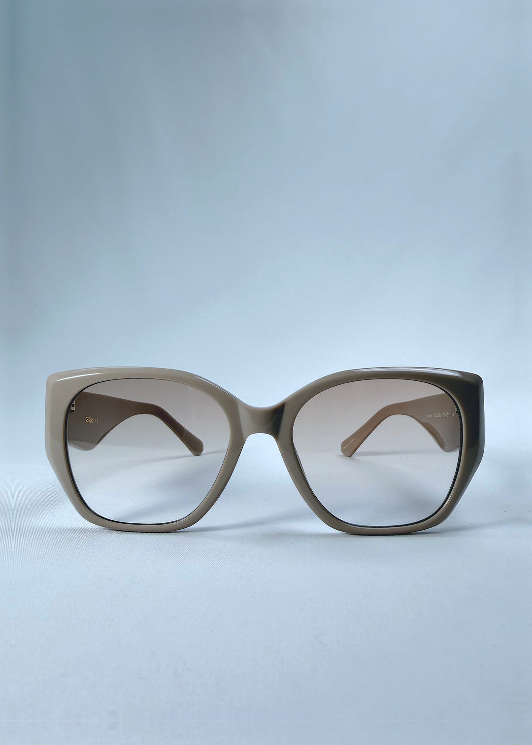 Front view of Marlowe sunglasses in Mauve Mist, featuring a sculpted translucent mauve acetate frame and soft gradient lenses, showing the full front silhouette.