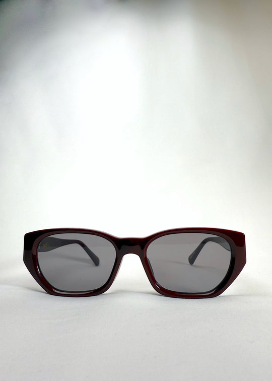 Front view of Mirach sunglasses in Burgundy, featuring a deep burgundy acetate frame and gray UV400 lenses, showing the full front silhouette. 