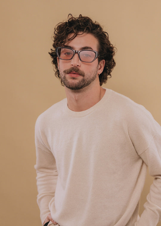 Male model wearing Mirach sunglasses in Transparent Gray. 