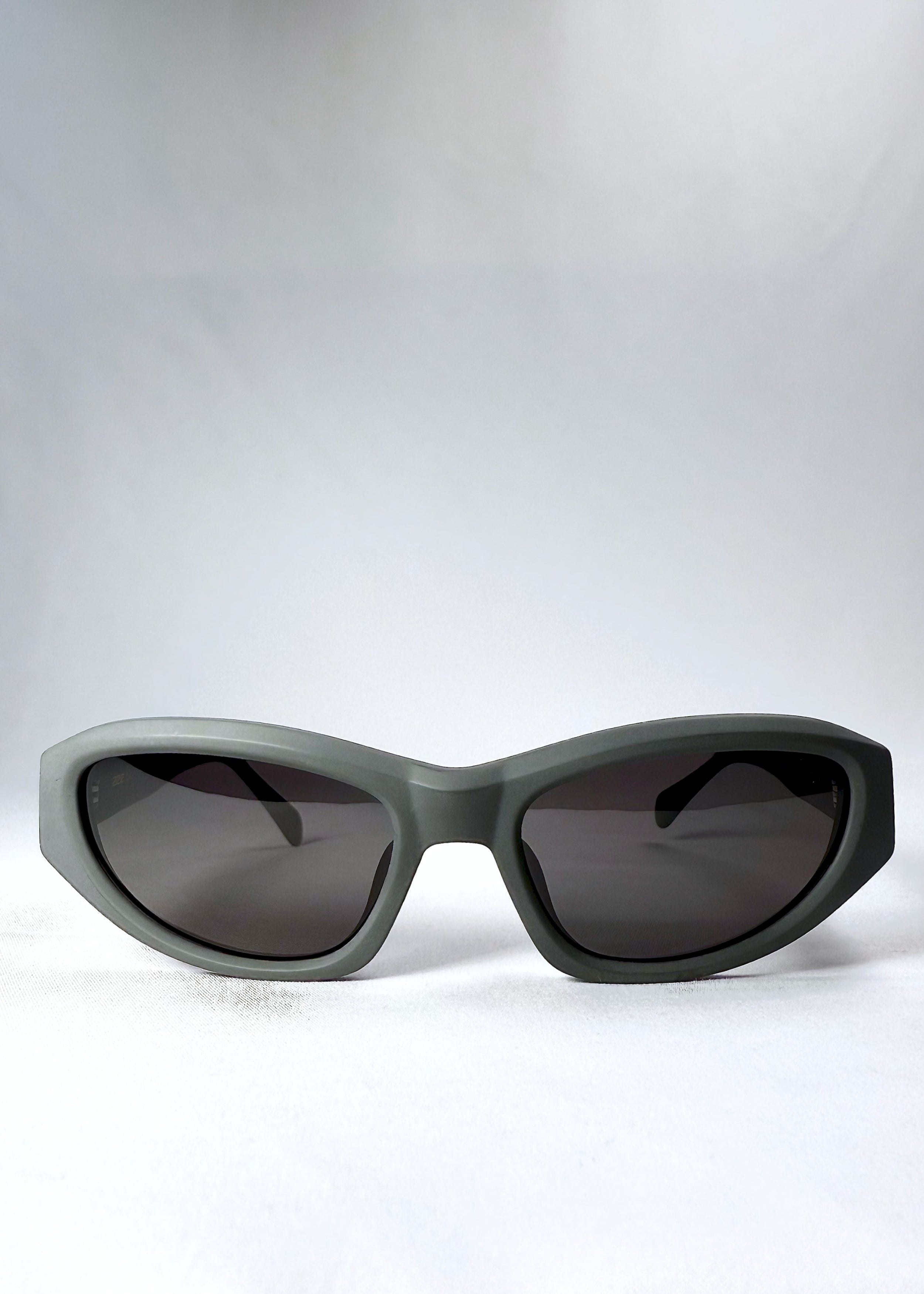 Front view of Nebula Shade in Carbon Ash showing the matte-finish thick cat-eye frame and dark polarized lenses
