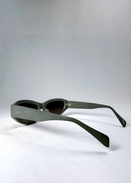 Side view of Nebula Shade sunglasses in Carbon Ash, showing the thick matte temples and engraved Aze logo. 