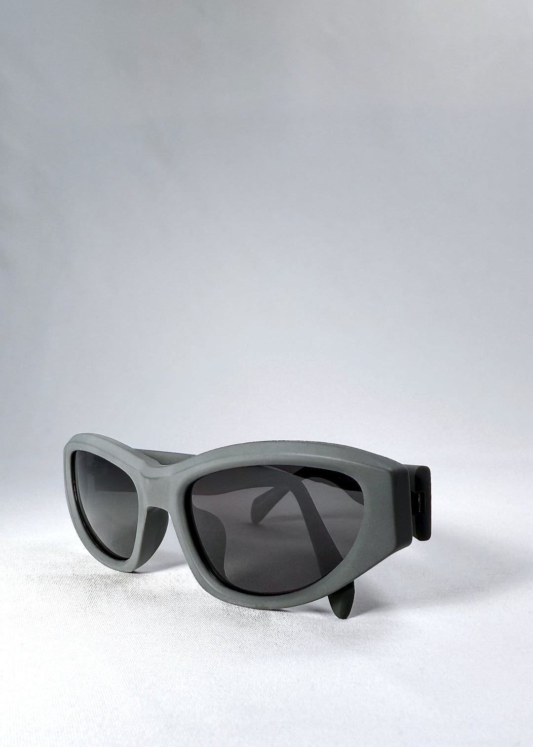 Close-up of the temple hinge on Nebula Shade in Carbon Ash, showing the clean hinge connection and matte finish. 