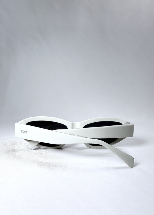 Nebula Shade in Glacial Ash shown folded flat, displaying the full width and structure of the temple arms. 