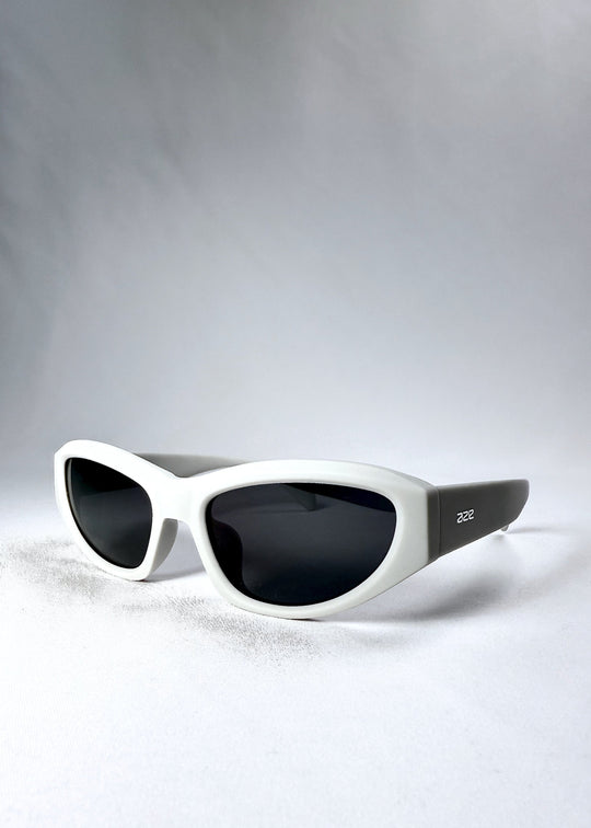 Angled front view of Nebula Shade sunglasses in Glacial Ash, highlighting the sculpted acetate build and cat-eye silhouette. 