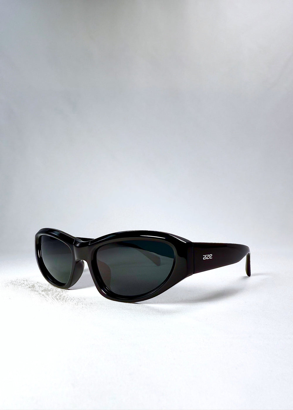 Front angle view of Nebula Shade - Obsidian Black showcasing the bold, thick cat-eye silhouette and subtle lens curvature. #color_obsidian-black