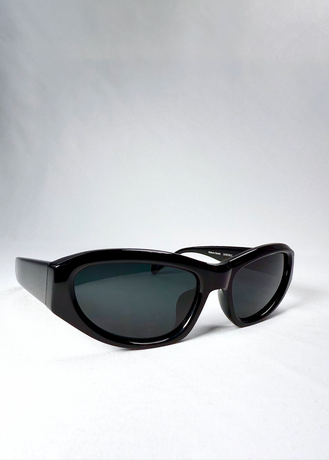 Lens closeup of Nebula Shade - Obsidian Black highlighting smoky grey-green tint and polarized coating. 