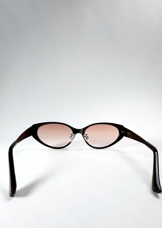 Back view of Nyx sunglasses in Blush Eclipse, showing the inner frame and curved temple arms. 