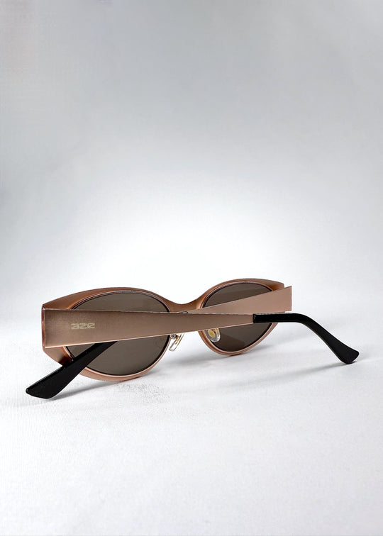 Folded view of Nyx sunglasses in Mocha Dusk, showing the compact frame and folded temples. 