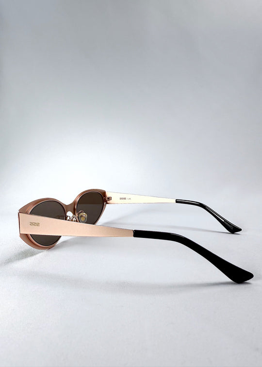 Close-up of the temple, AZE logo and satin bronze finish on Nyx sunglasses in Mocha Dusk. 