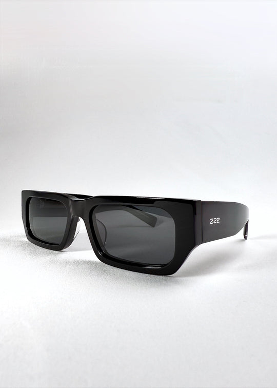 Front-angle view of Oblivion Trace in Obsidian Black, highlighting the sculptural frame and deep black finish. 