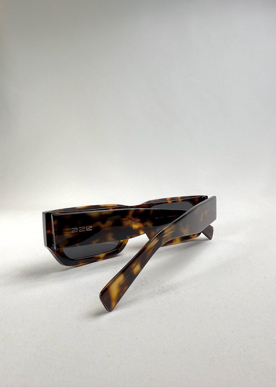 Folded view of Oblivion Trace in Tortoise, displaying the clean, geometric frame with AZE logo on the temple. 