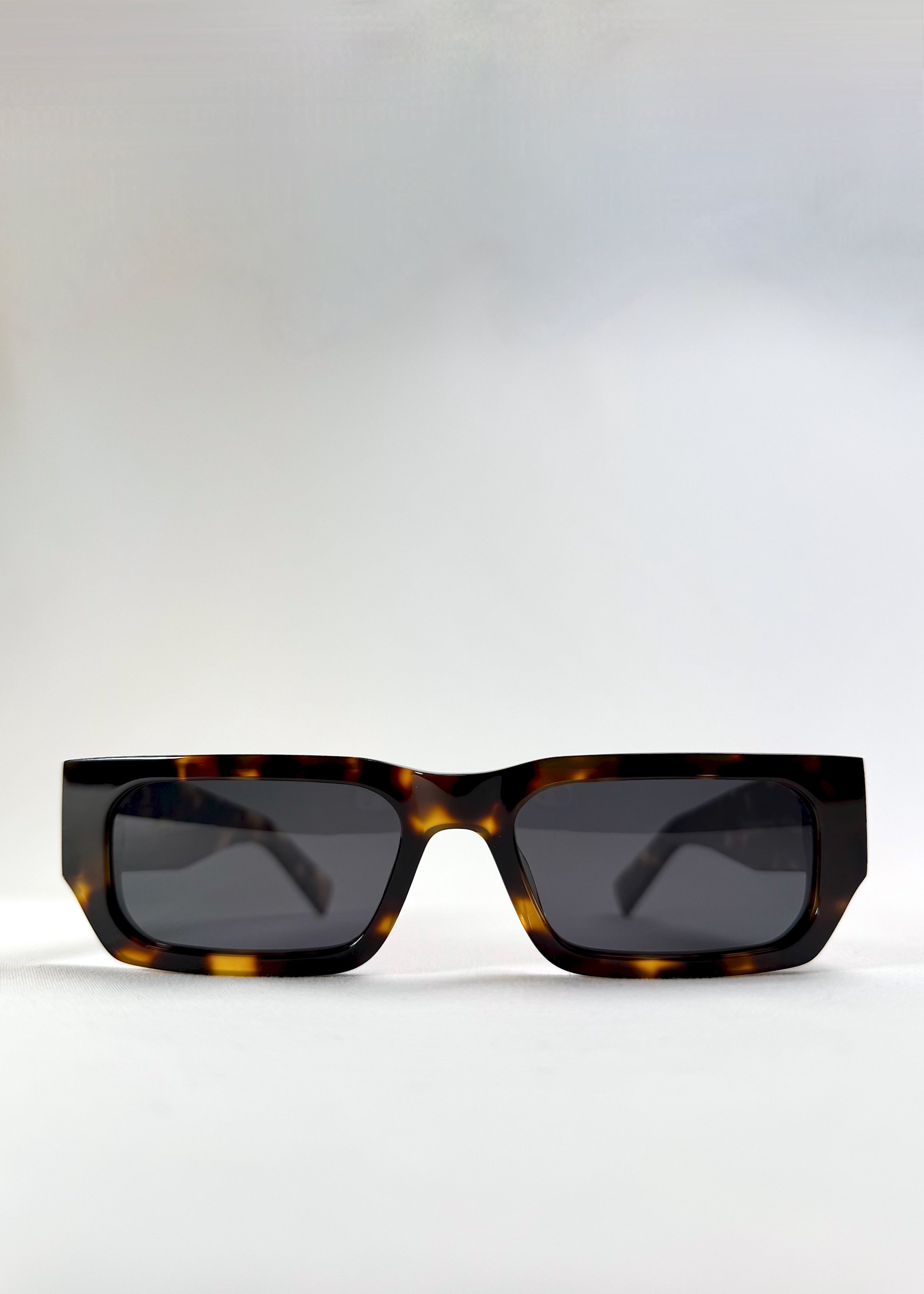 Front view of Oblivion Trace in Tortoise, showing bold rectangular frame and UV400 polarized lenses.