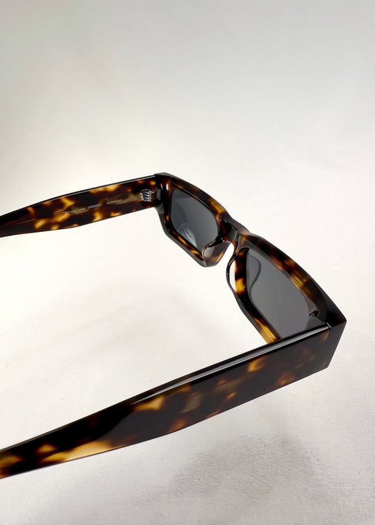 Inside detail of Oblivion Trace in Tortoise, showing engraved model info and inner hinge structure. 