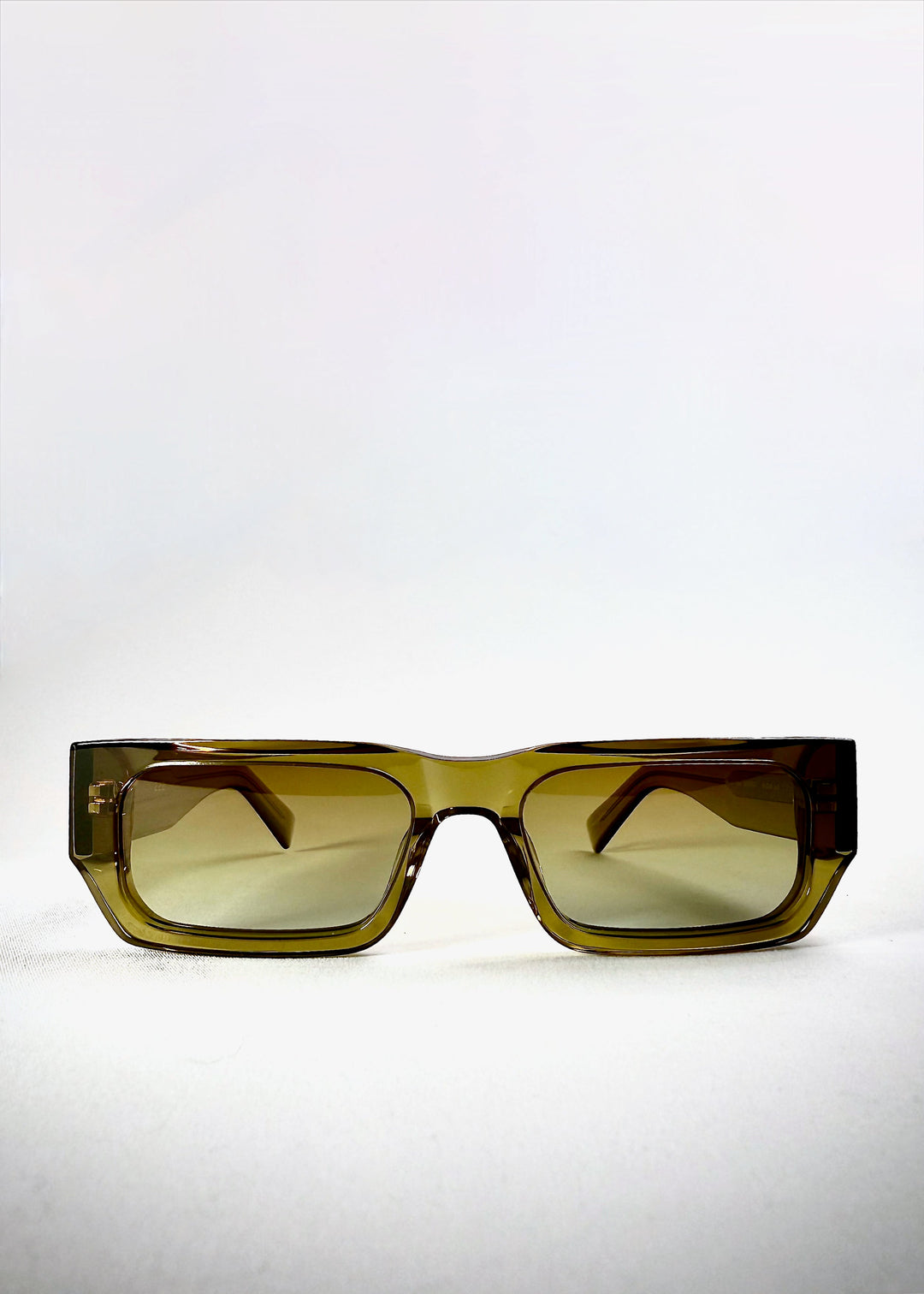 Oblivion Trace - Verdant Gold prescription sunglasses, front-on view showcasing rectangular green polarized lenses. 