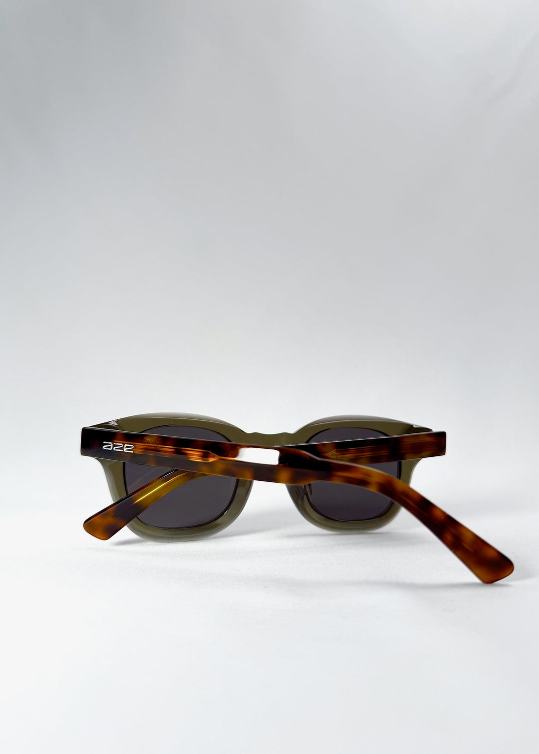 Folded back view of Phantom Verge in Ash Tortoise, showing the tortoiseshell temple arms and compact profile. 
