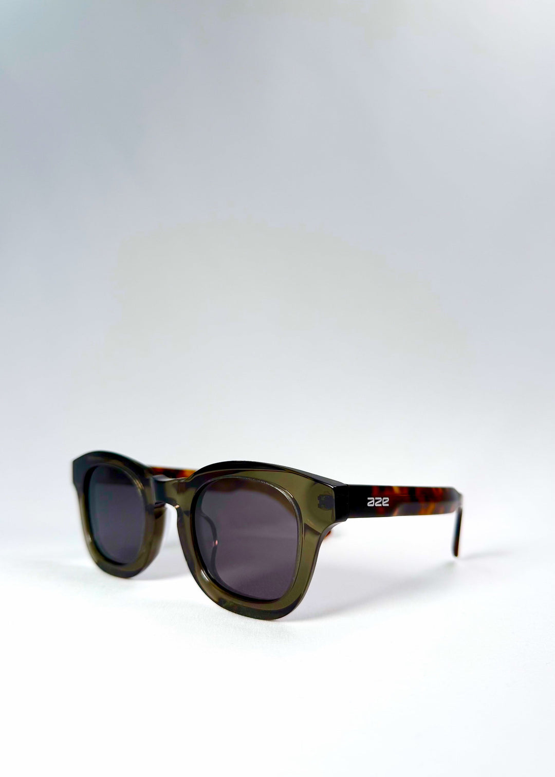 Front-angle view of Phantom Verge in Ash Tortoise, showing the layered acetate construction and refined greenish-grey tint. 