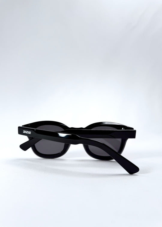 Folded view of Phantom Verge sunglasses in Obsidian Black, emphasizing portability and frame thickness. 
