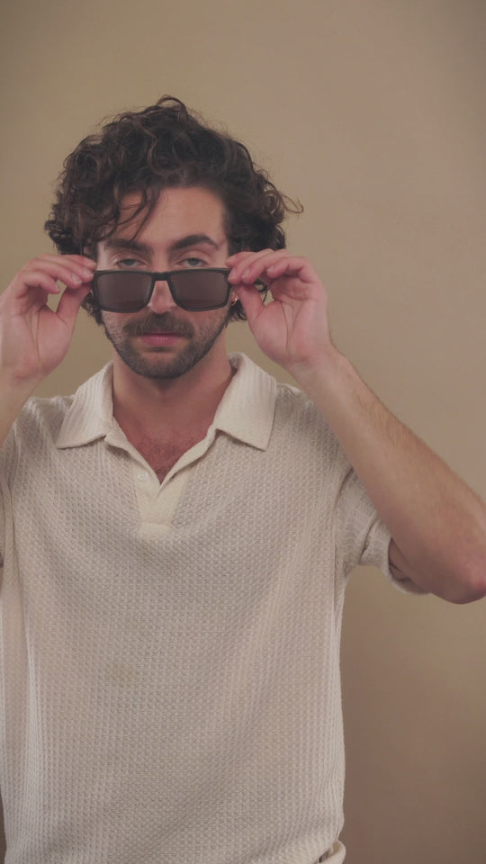 Video of a male model wearing Betelgeuse matte brown sunglasses. 