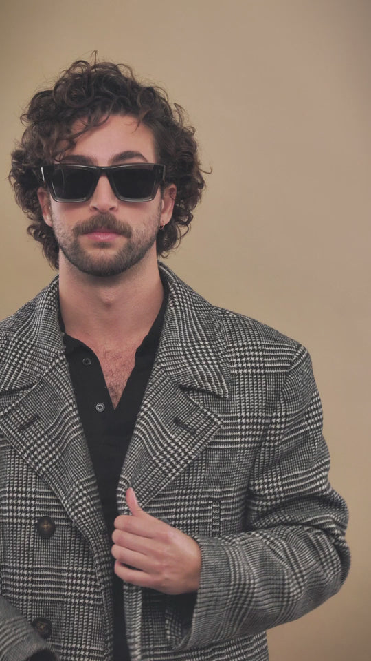Lifestyle video of a male model wearing Fomalhaut gray-green acetate prescription sunglasses. 