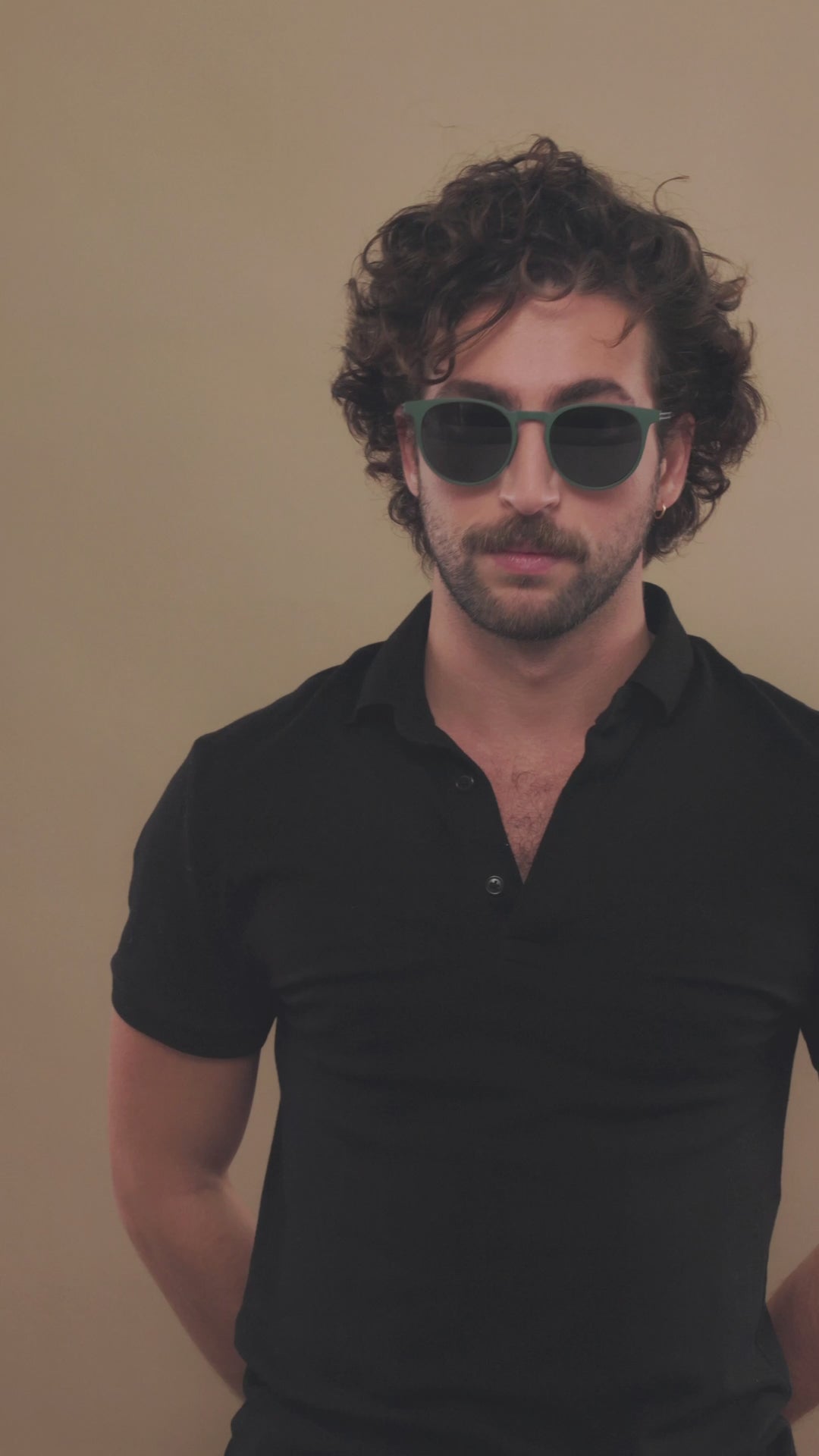 Lifestyle video of a female model wearing Altair sunglasses in Matte Green. 