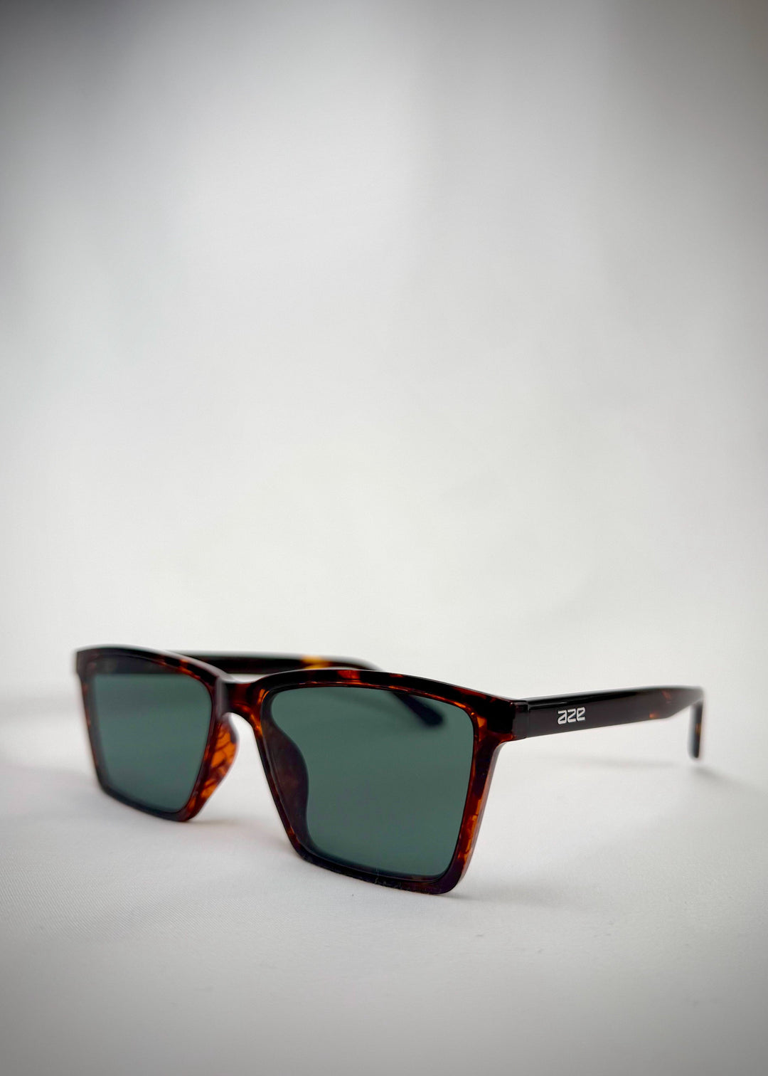 Angled side view of Rho Tortoiseshell sunglasses, highlighting the sleek frame design. 