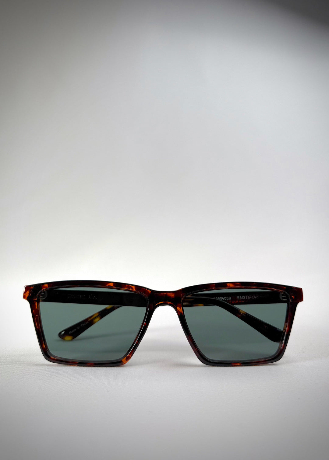 Front view of folded Rho Tortoiseshell acetate prescription sunglasses, showcasing the stylish tortoiseshell pattern. 