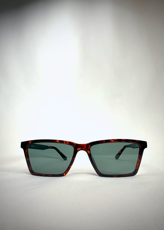Front view of Rho Tortoiseshell acetate prescription sunglasses with green lenses. 