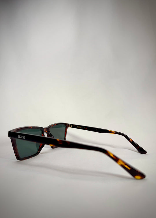 Side view of Rho Tortoiseshell acetate prescription sunglasses, showcasing the rich tortoiseshell pattern and sleek temple design. 