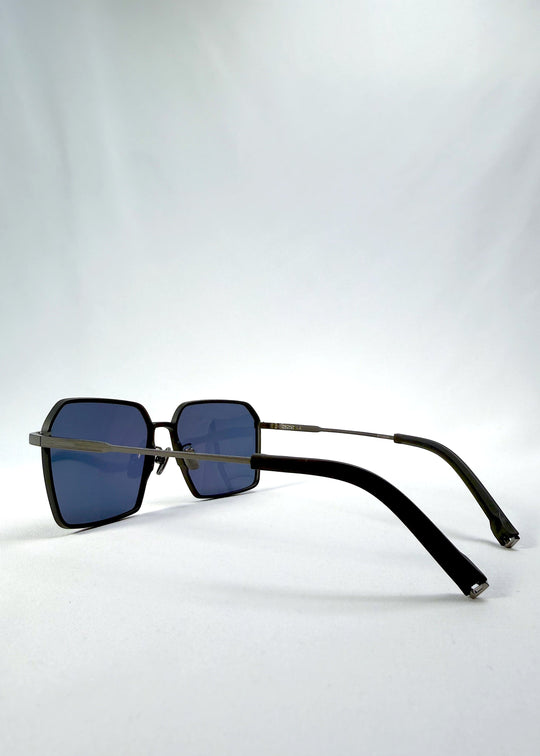 Side-angle view of Rigel sunglasses in Blue Graphite, featuring an ultra-light frame with titanium temples, geometric lens shape, and polarized lenses, showing the lens shape and temple profile. 