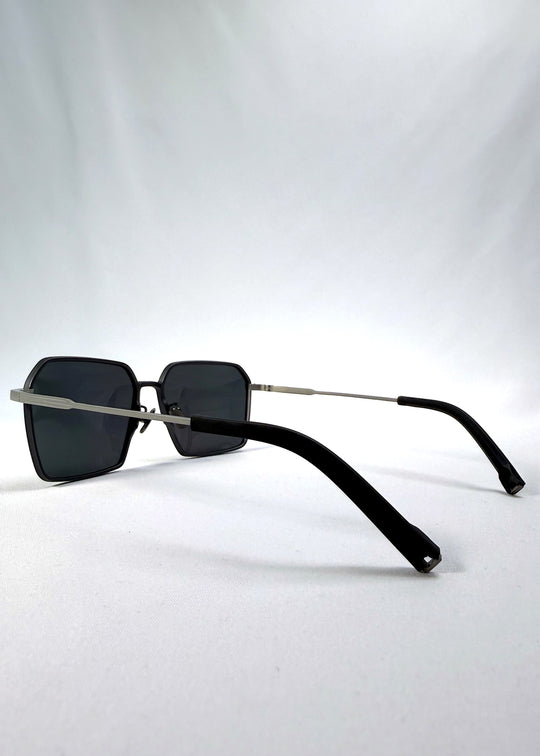 Side-angle view of Rigel sunglasses in Matte Blue, featuring ultra-light titanium frame, geometric lens shape, and polarized lenses, showing the lens shape and temple profile.