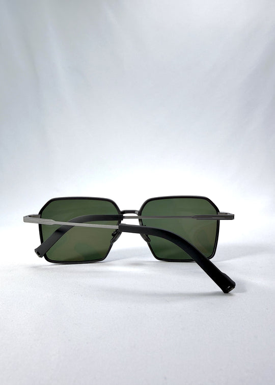 Folded view of Rigel sunglasses in Matte Gray, featuring ultra-light titanium frame, geometric lens shape, and polarized lenses, showing the folded temples and frame profile.
