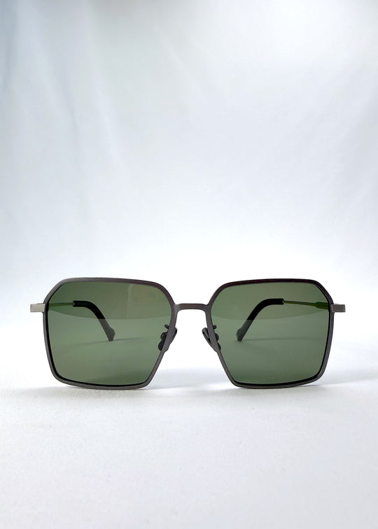 Front view of Rigel sunglasses in Matte Gray, featuring ultra-light titanium frame, geometric lens shape, and polarized lenses, showing the full front silhouette.