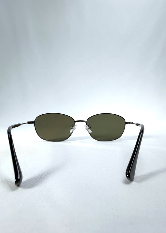 Back view of AZE Selene Line sunglasses in Sage Gunmetal, featuring a slim gunmetal oval metal frame and sage-green lenses, showing the inner frame and open temples.