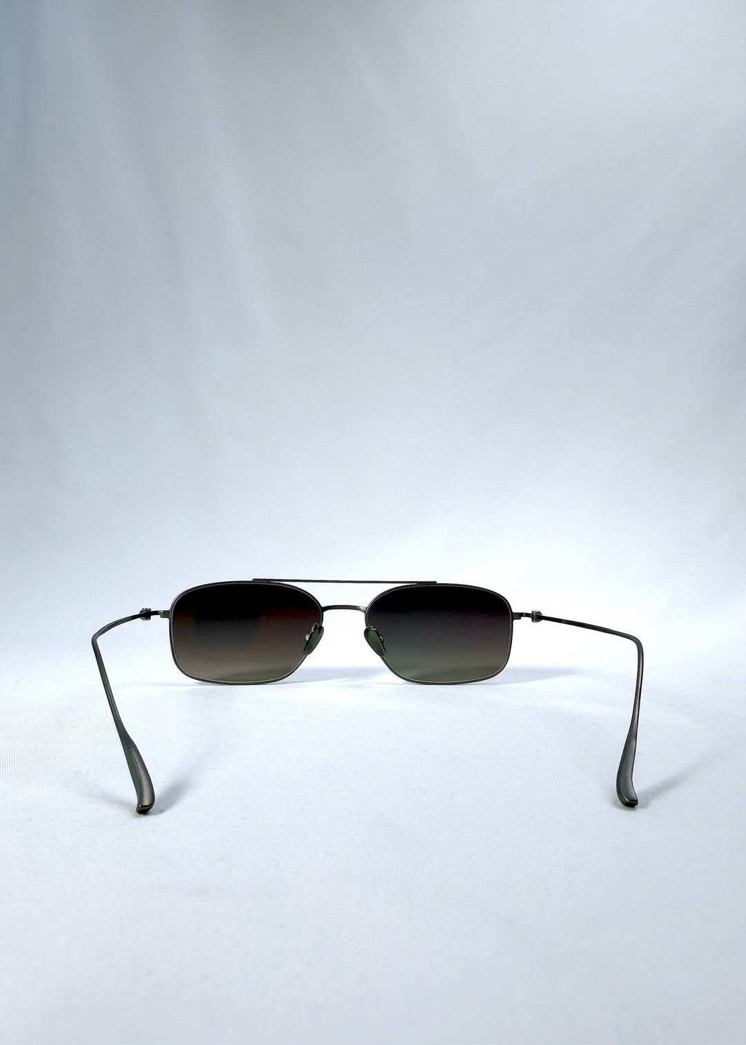 Back view of Seren Arc sunglasses in Mocha Alloy, featuring mocha metal frame and rose-brown lenses, showing the inside frame and open temples.