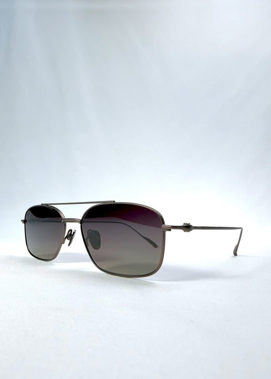 Three-quarter front view of Seren Arc sunglasses in Mocha Alloy, featuring mocha metal frame and rose-brown lenses, showing the front shape and temple profile. 