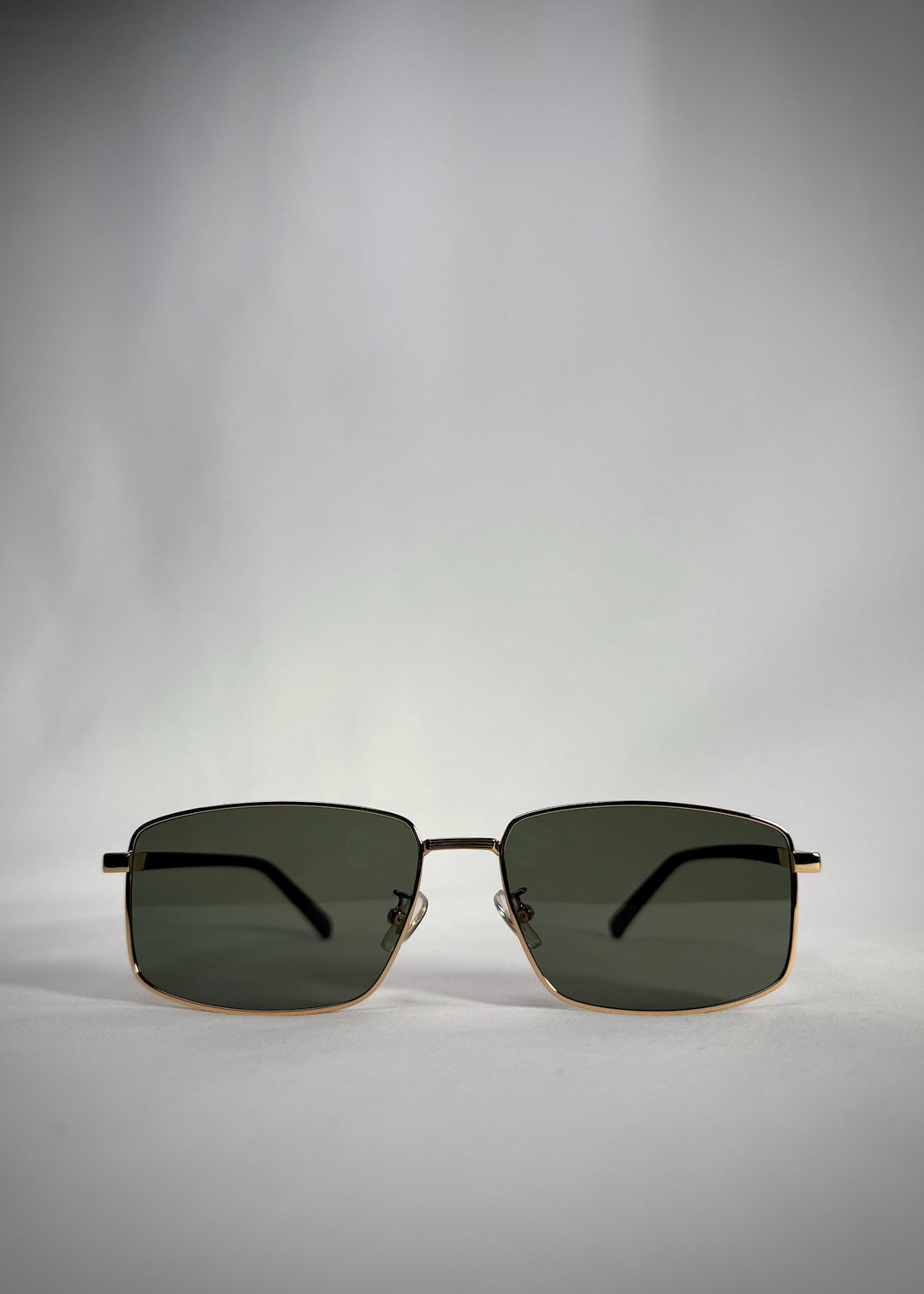 Front view of Sirius A - Gold stainless steel sunglasses with polarized green lenses – a perfect blend of classic luxury and modern precision. 