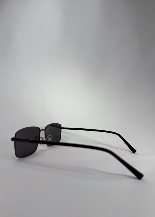 Side view of Sirius A sunglasses in Gunmetal Gray, showing the lightweight stainless-steel frame and adjustable nose pads. 
