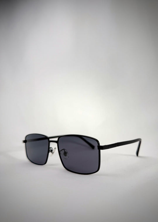 Angled view of Sirius A - Semi-Matte Black sunglasses, showing the smooth matte finish and durable hinge construction. 