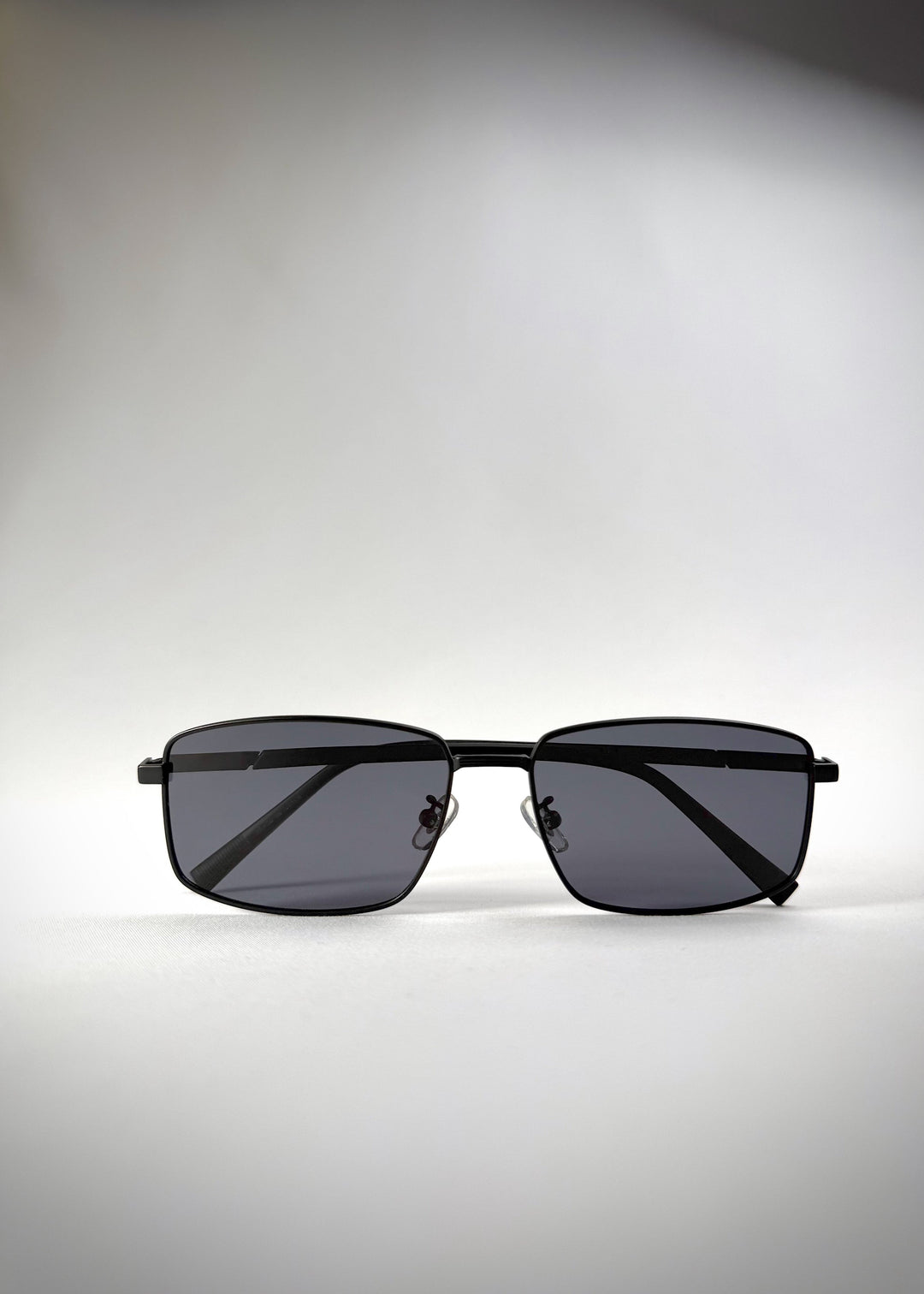 Folded view of Sirius A - Semi-Matte Black sunglasses, illustrating the compact and portable design. 