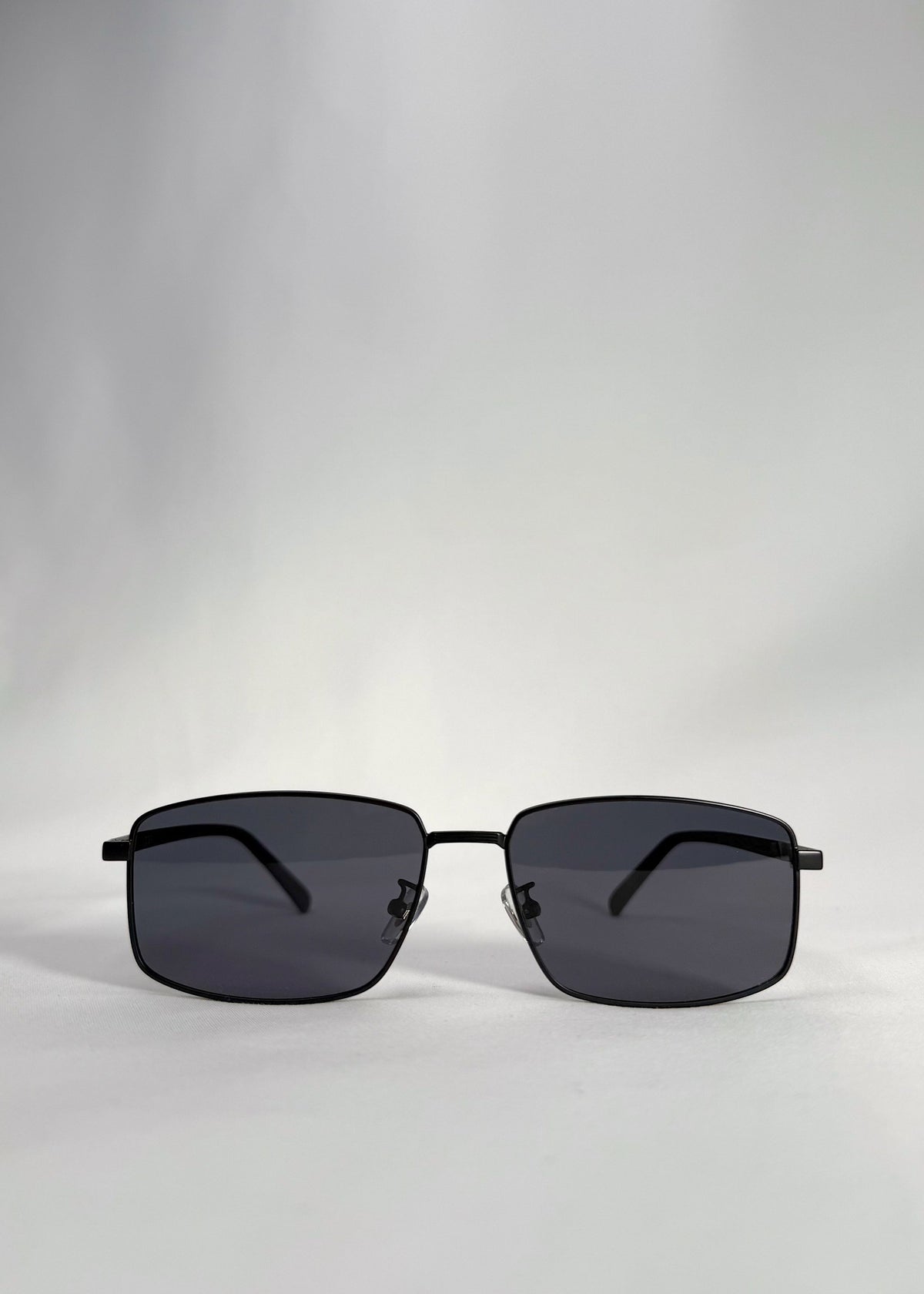 Front view of Sirius A sunglasses in Semi-Matte Black with a slim stainless-steel frame and polarized lenses.