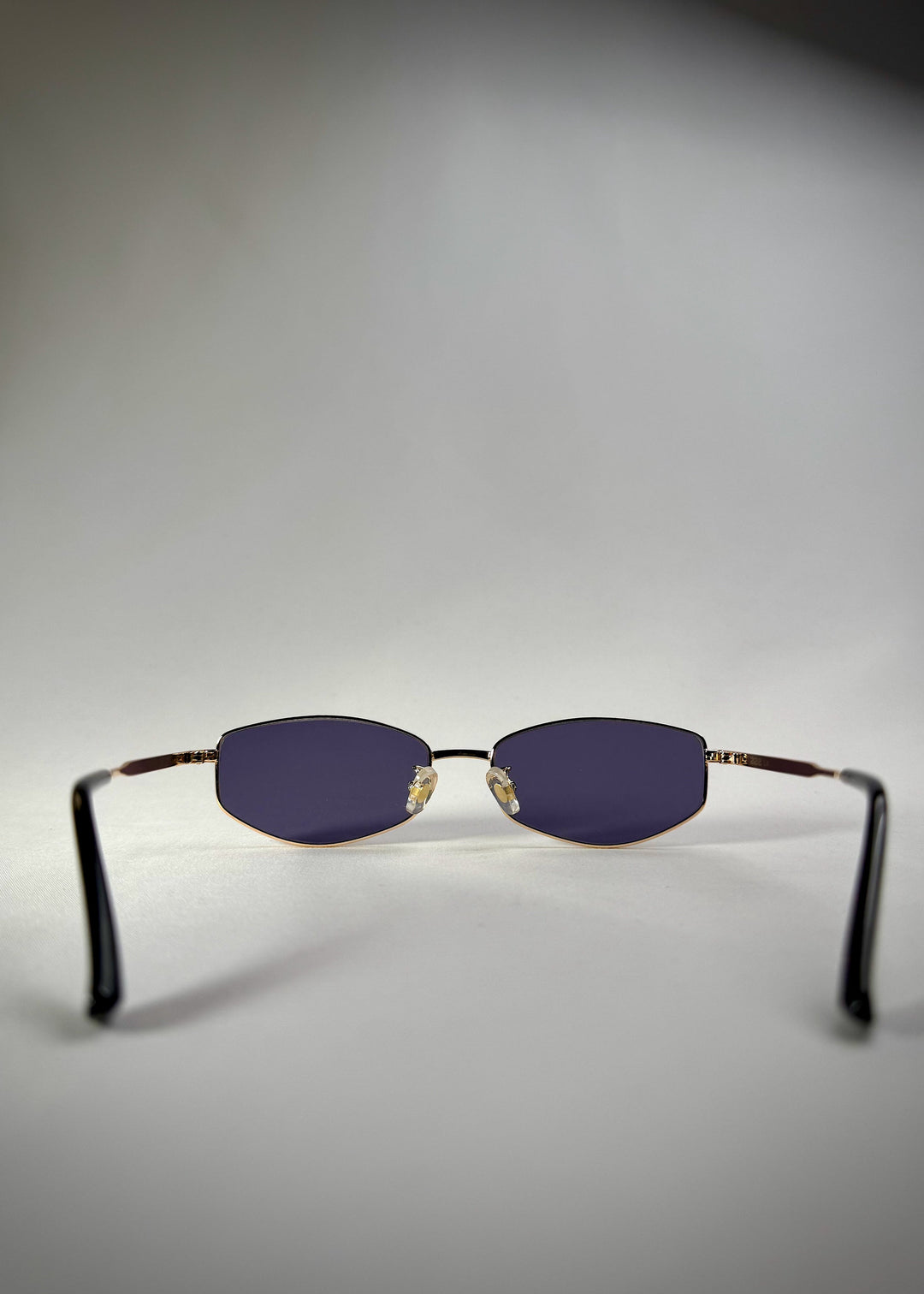Back view of Sirius B gold stainless steel frame – Premium Prescription Sunglasses with blue-gray lenses for a sleek, modern style. 