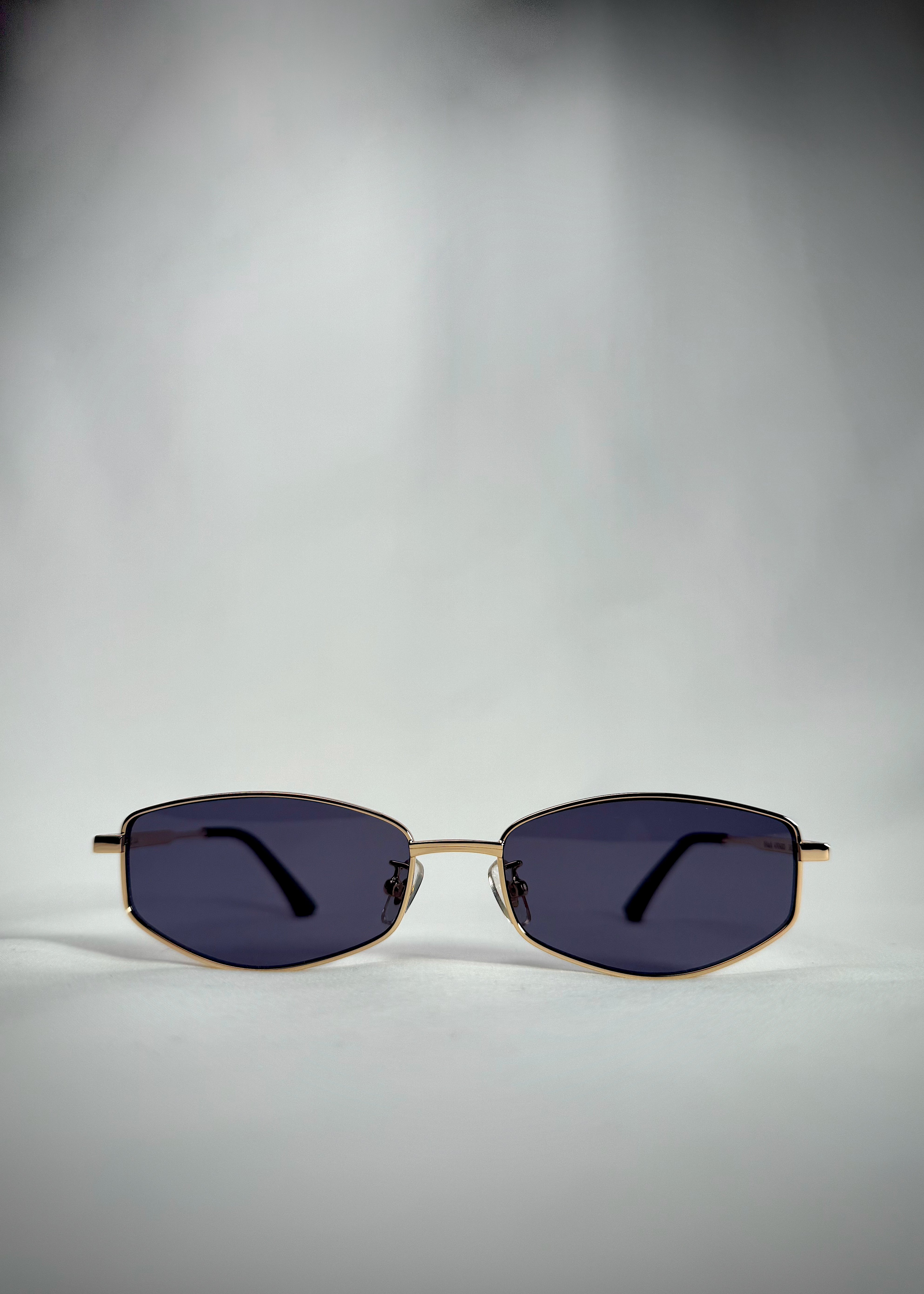 Front view of Sirius B - Gold stainless steel sunglasses with blue-gray UV400 lenses, designed for a sleek and refined look.
