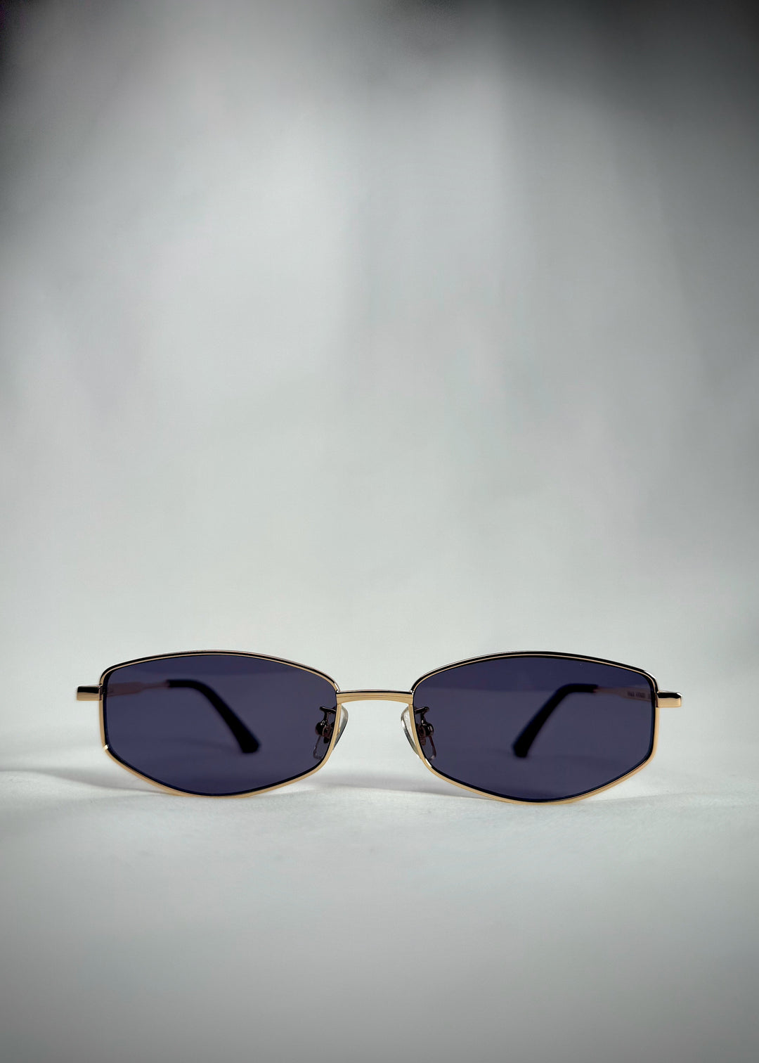 Front view of Sirius B - Gold stainless steel sunglasses with blue-gray UV400 lenses, designed for a sleek and refined look. 